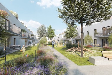 Das Bild zeigt den Hof einer Wohnhausanlage der durch Wiese, Blumen und Bäume begrünt ist.