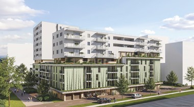 Darstellung des zukünftigen Gemeindebaus in der Ljuba -Welitsch-Promenade 18. Die Fassade ist begrünt und das Gebäude ist umgeben von Bäumen. Im Hintergrund sind auch andere Gebäude zu sehen.