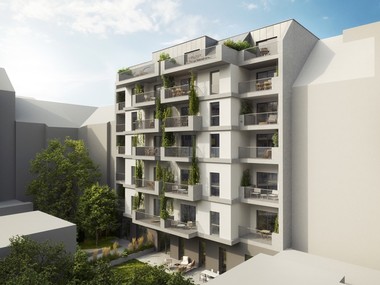 Das Bild zeigt eine weiße Wohnhausanlage mit begrünten Balkonen